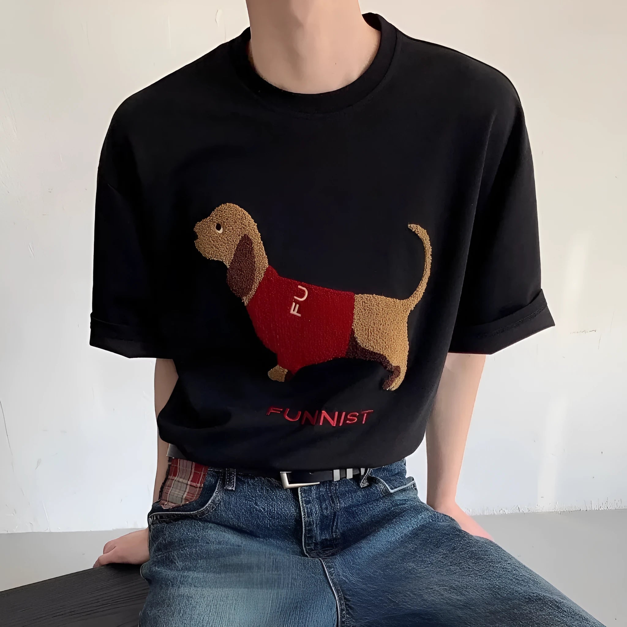 Grey men's cotton T-shirt with an embroidered cartoon dachshund holding a towel.