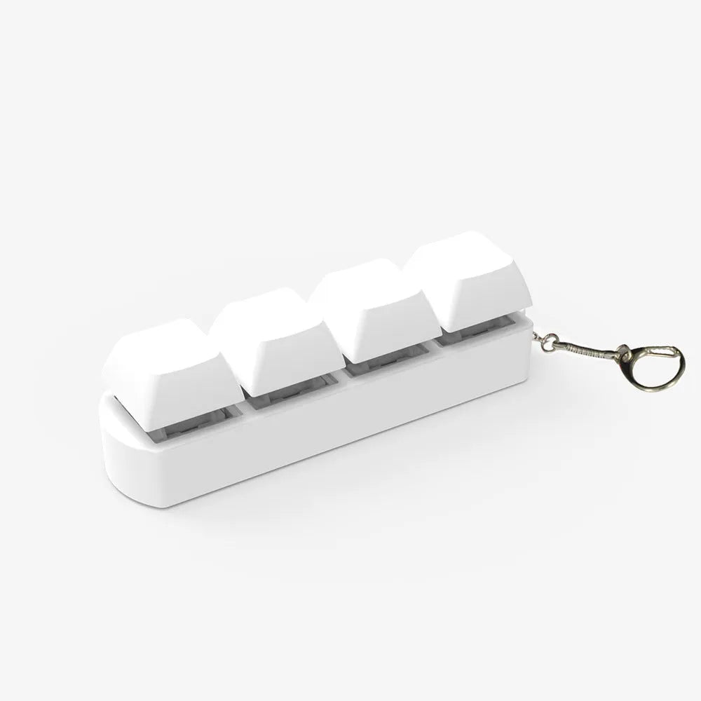 4-key mechanical keyboard switch tester with transparent bottom shell on desk