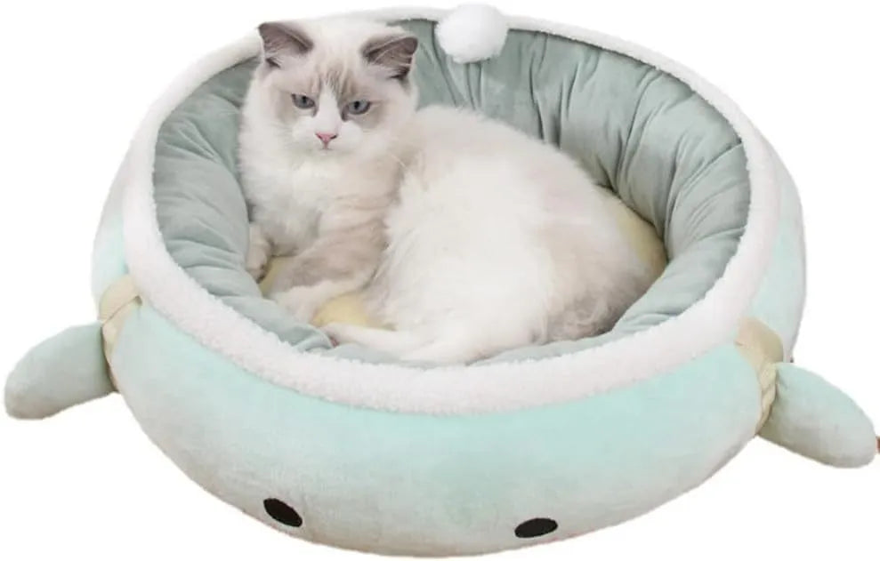 Green dinosaur-shaped cat bed with hanging straps that can be used flat or as a hammock