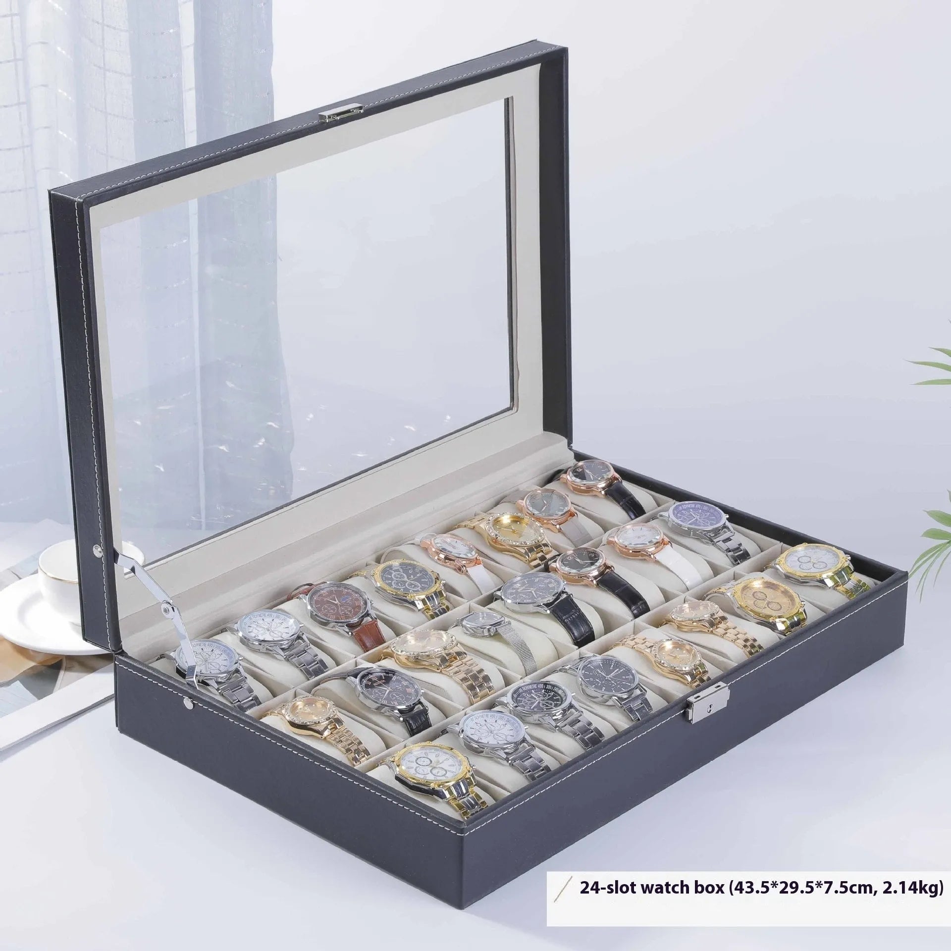 Grey leather watch storage box with transparent lid showing multiple watch slots inside