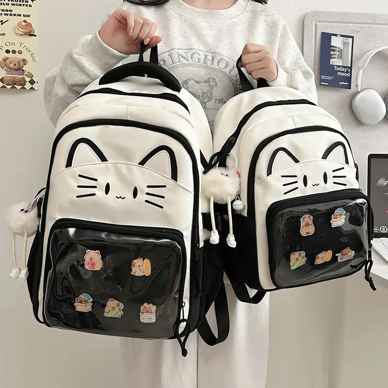 Korean cartoon large capacity nylon backpack in pink colour with badge pendant.
