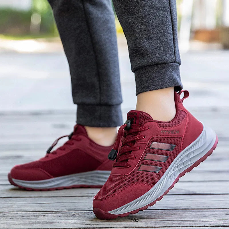 Men's and women's breathable mesh casual shoes with elastic band and non-slip sole in multiple colours.