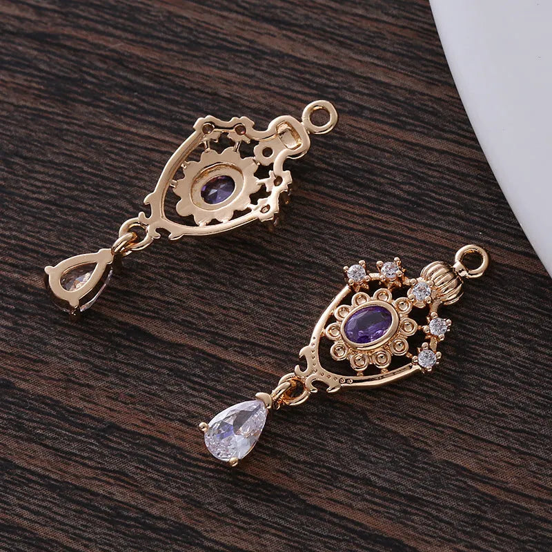 Small copper water-drop pendant with crown design in assorted colours.