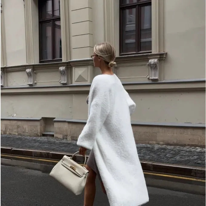 White women's sweater cardigan jacket with extended length and loose fit design