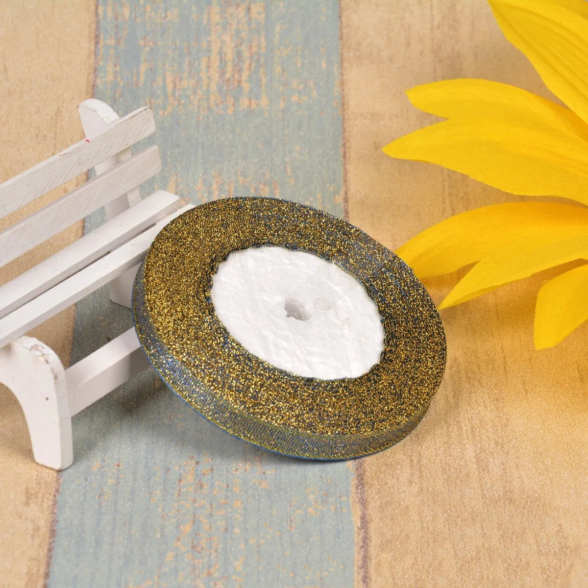 Polyester ribbon spool in metallic colours for decorative clothing and gift packaging trim