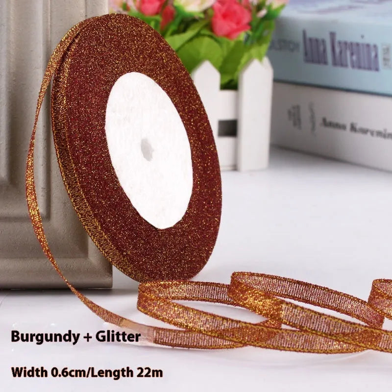 Roll of polyester gift ribbon showing 0.6cm width and multiple colour options including metallic finishes