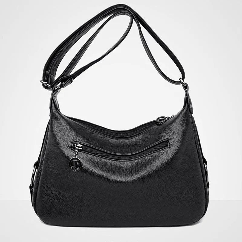 Blue horizontal square women's shoulder bag with soft PU construction and visible sewing thread detailing