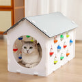 Integrated cat scratch board and nest toy with tunnel and bell ball for house cats