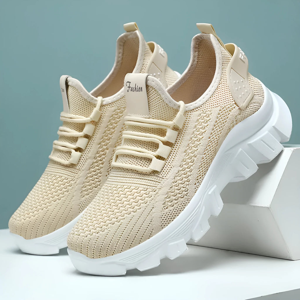 Women's breathable Flyknit sneaker with thick bottom PVC sole and round toe in white, pink, beige, or black.