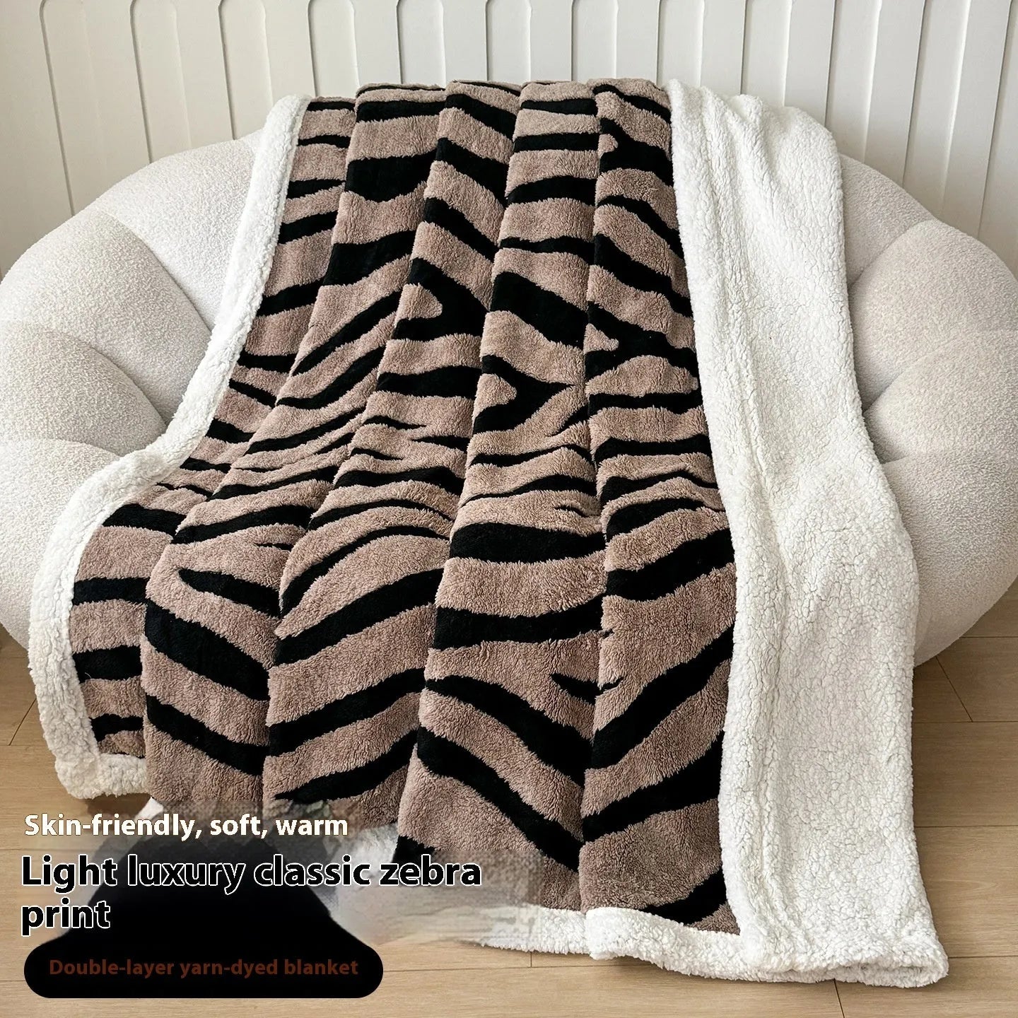 Double-layer Jacquard taffeta blanket with leopard print design in camel colour folded to show texture and pattern detail