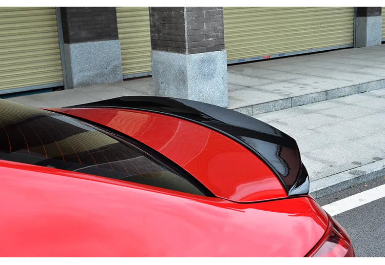 Mazda 3 Axela Exela tail trim spoiler accessory for 2014-2021 models in bright black and carbon grain options