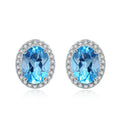 Geometric design 925 sterling silver jewellery set with blue topaz, showing earrings, ring, pendant and necklace.