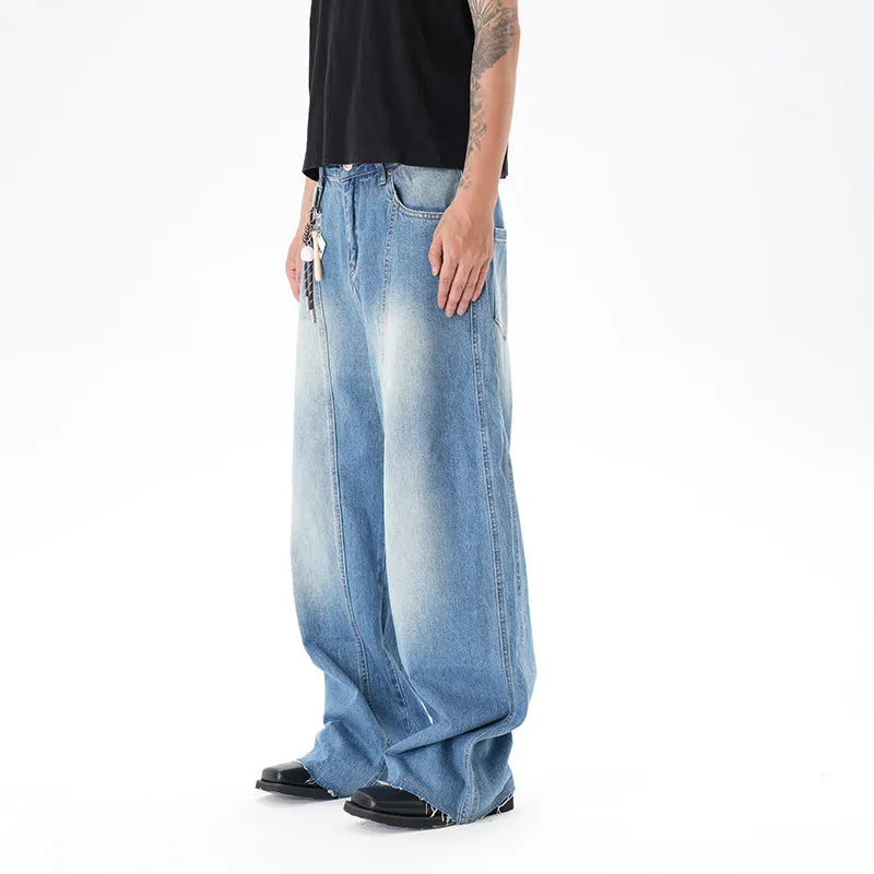 Light blue vintage washed wide leg machete jeans with a straight fit and zipper fly on a model.