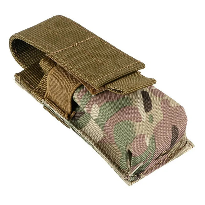Black tactical MOLLE waist bag with elastic cord buckle, shown next to a small flashlight