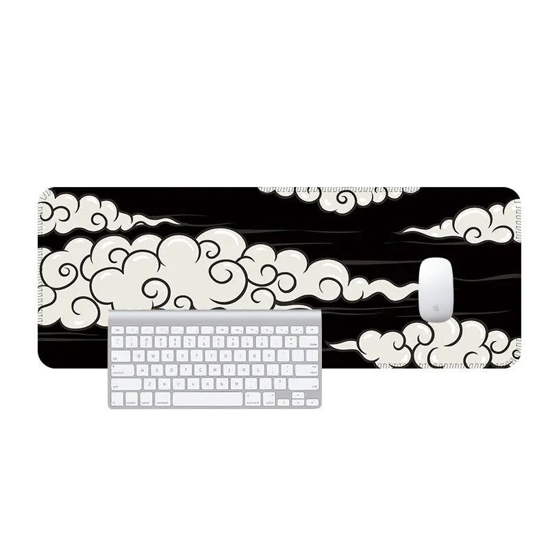 Large natural rubber desk mat with Japanese cloud pattern on a wooden desk, showing non-slip base.