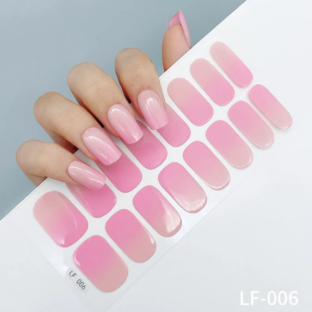 Sheet of 16 solid colour nail art sticker designs including cross, rose, and leopard print patterns.
