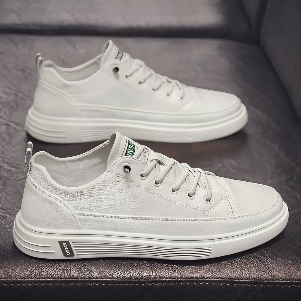 Men's white casual shoes with round toe, flat bottom, and shallow opening design