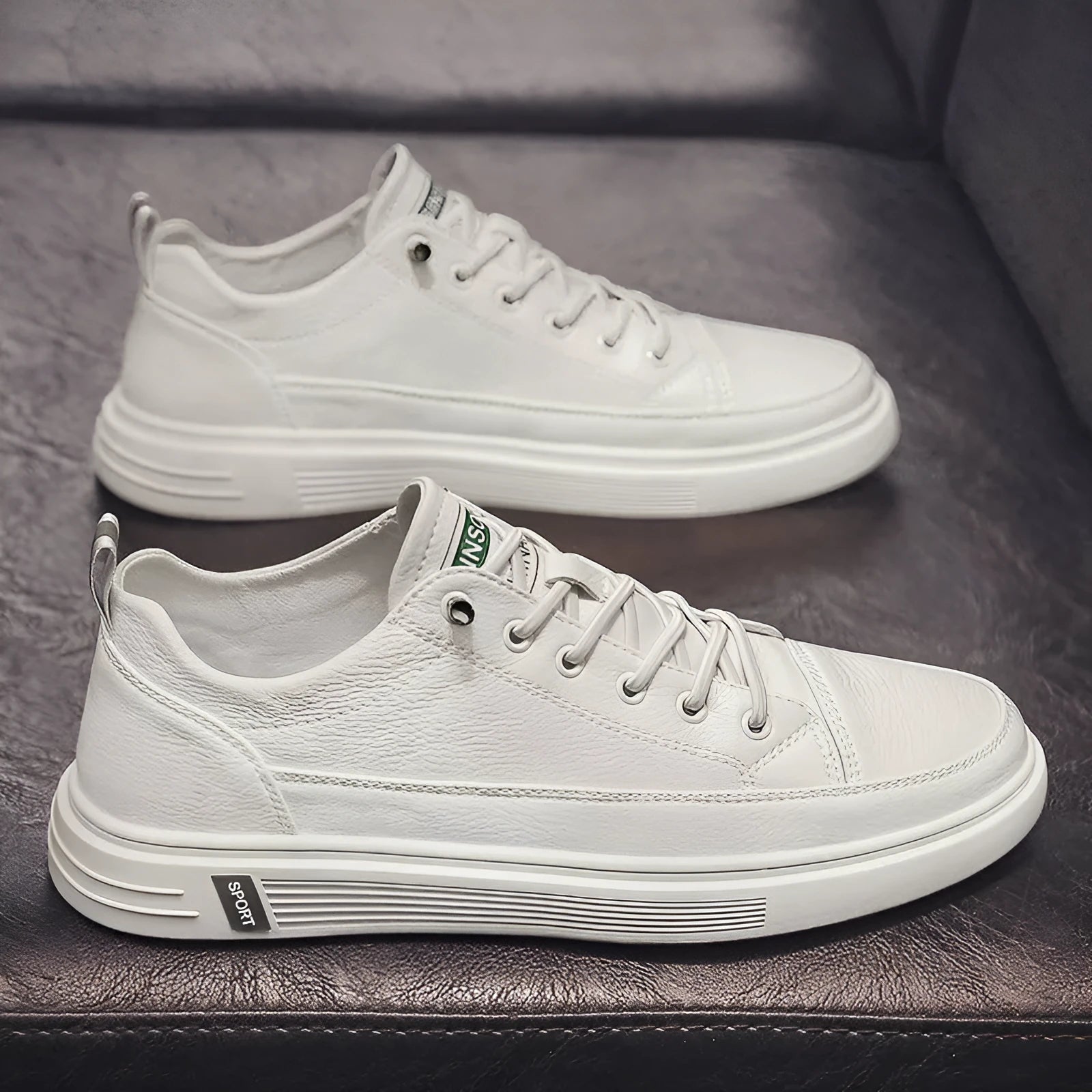 Men's white casual shoes with round toe, flat bottom, and shallow opening design