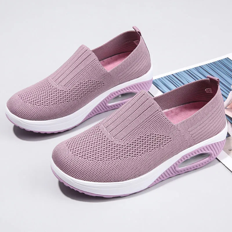 Women's casual running shoes with mesh and PU upper in light gray, showing round toe and mid heel.