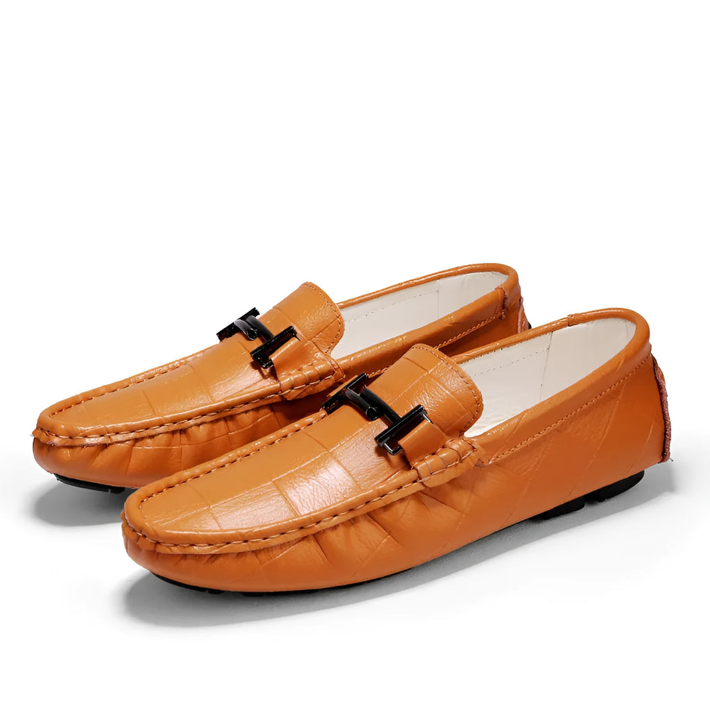 Men's black leather casual peas shoes with a belt buckle and flat rubber sole.