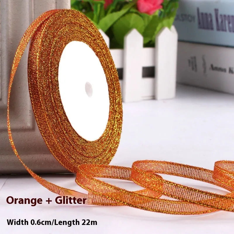 Roll of polyester gift ribbon showing 0.6cm width and multiple colour options including metallic finishes