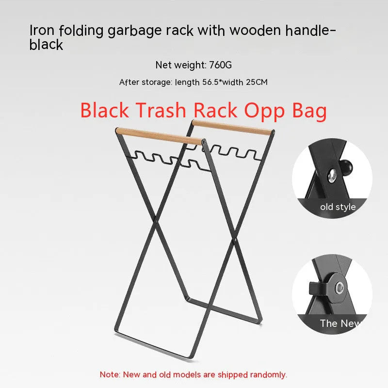 Black iron folding storage rack with a wooden handle for hanging outdoor waste bags.