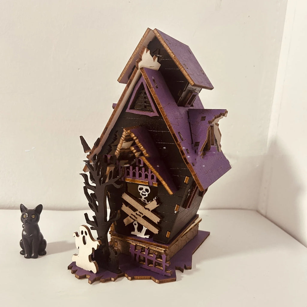 Wooden Halloween haunted house table decoration with luminous finish measuring 14x10.5x19cm