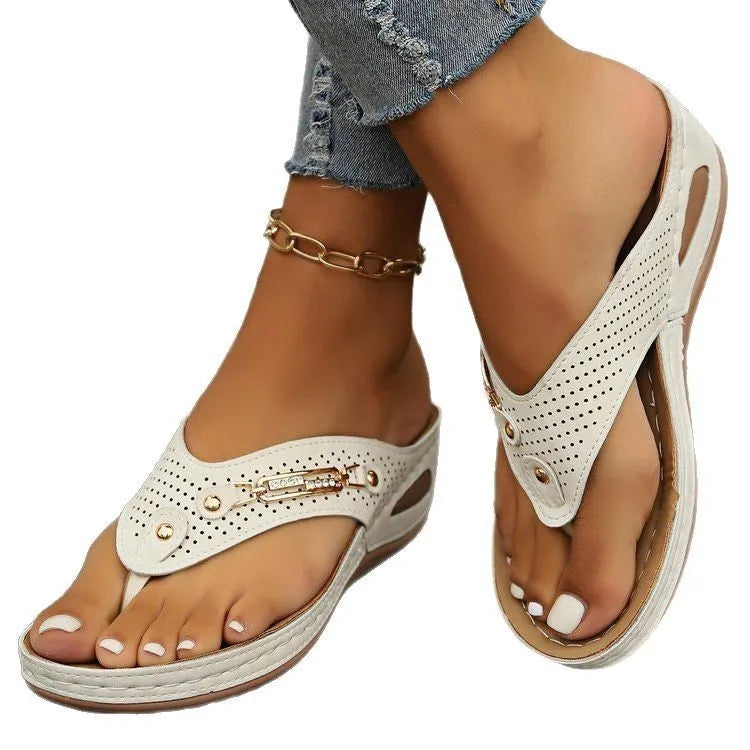 Women's retro flip-flop sandals in beige, showing PU upper and textured sole, on a plain background.