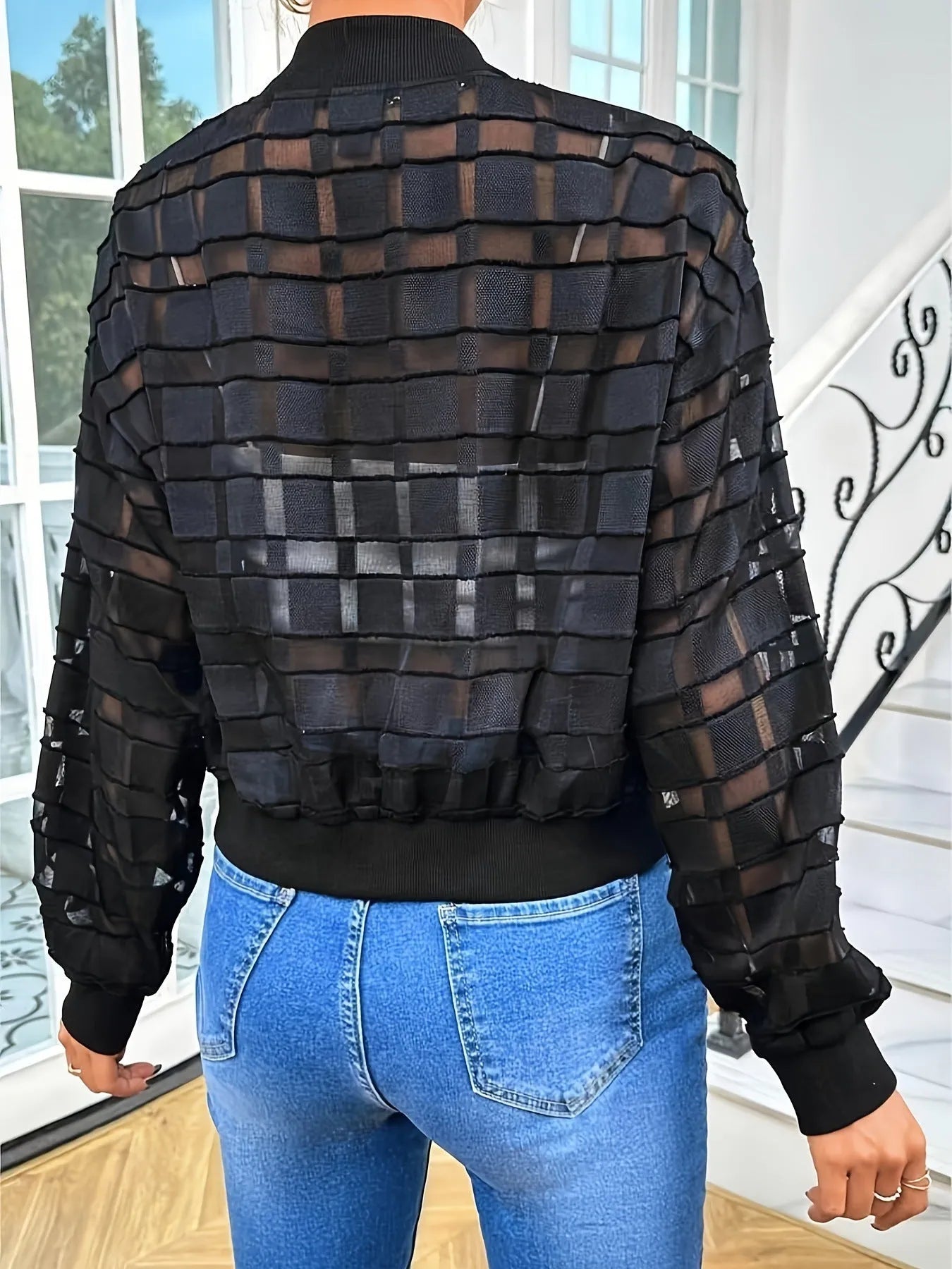 Black women's casual jacket with a geometric pattern, semi-transparent polyester fabric, and a thread zipper.