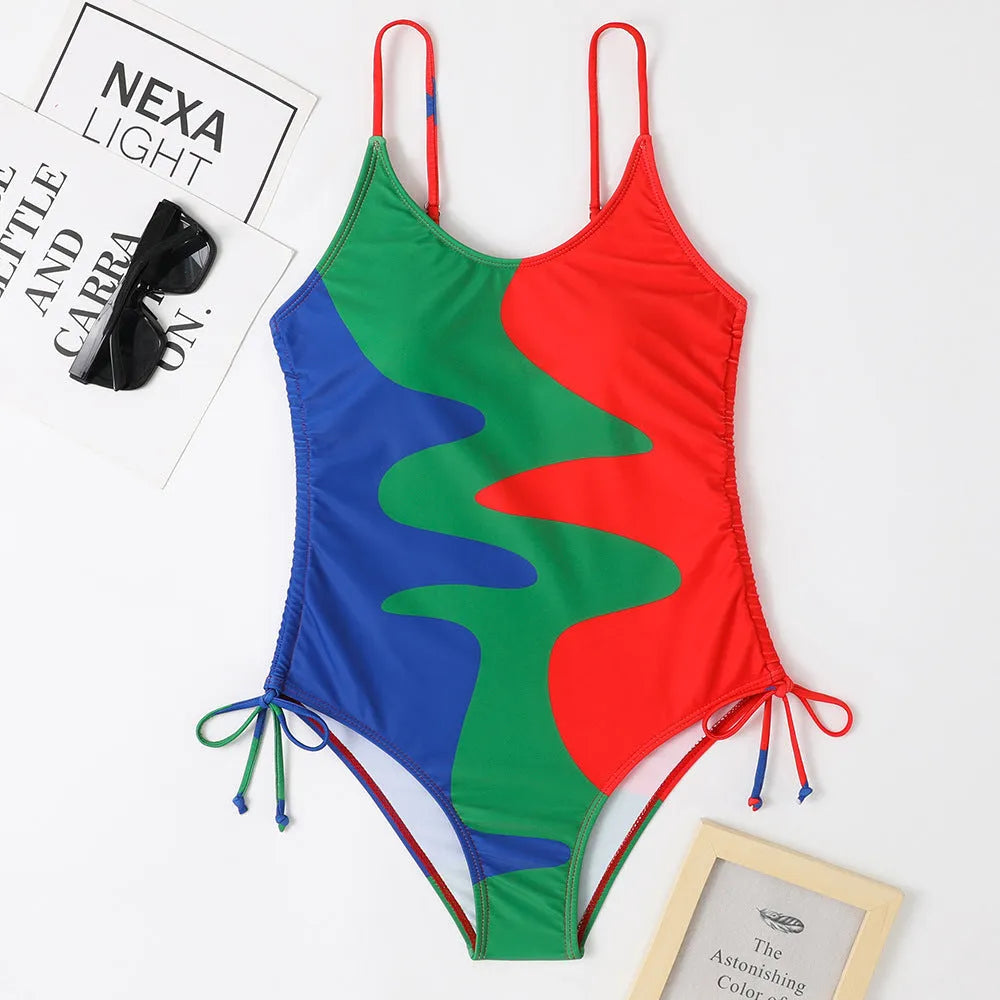 Women's sleeveless backless one-piece swimsuit in blue, shown on a mannequin.