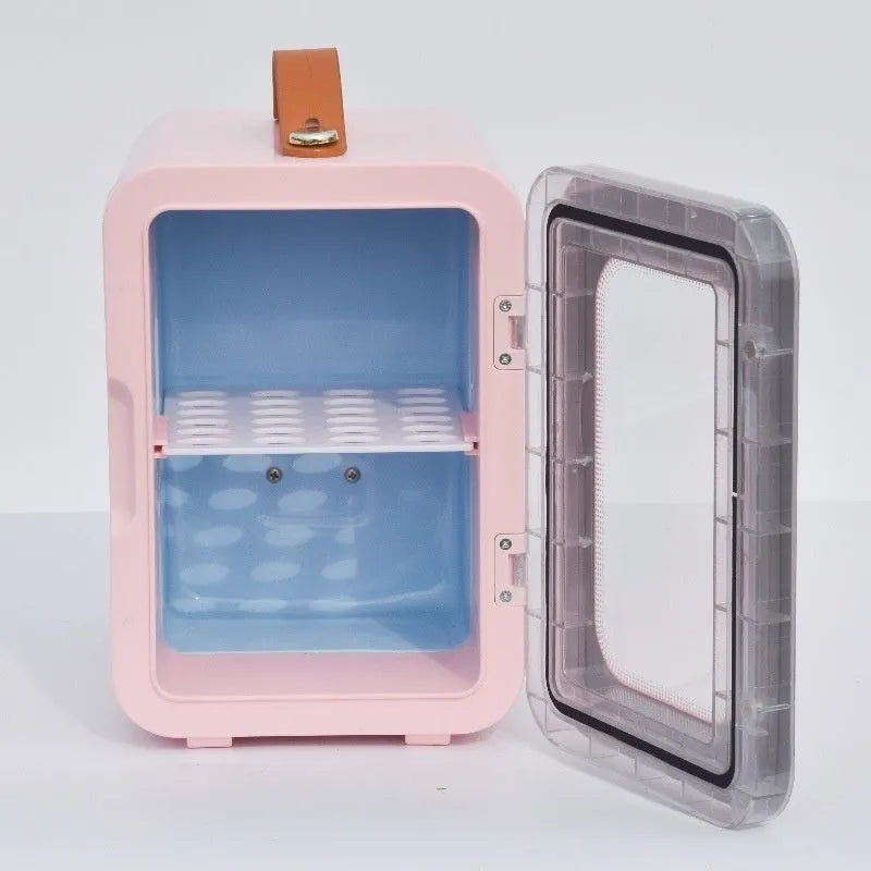 Pink mini refrigerator with transparent door showing internal storage compartments