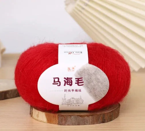 Single ball of mohair yarn in various colours for hand-woven DIY scarf knitting projects