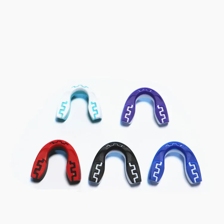 Adult boxing mouthguard with printed teeth design in black and white, for martial arts protection.