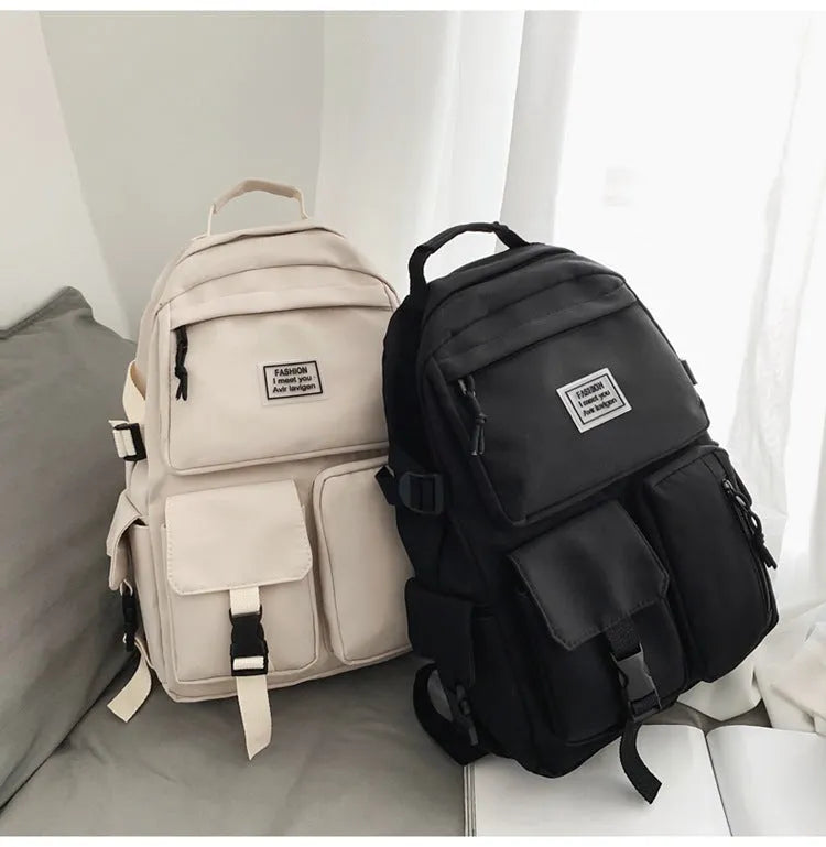 Black and white nylon student backpack with laptop compartment and three-dimensional pockets
