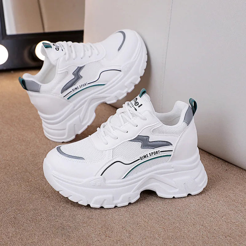 Beige women's lace-up dad shoes with cross straps and a round toe, on a white background.