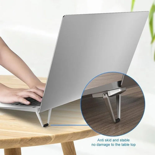 Foldable aluminum laptop bracket showing silver alloy construction and 3M adhesive backing