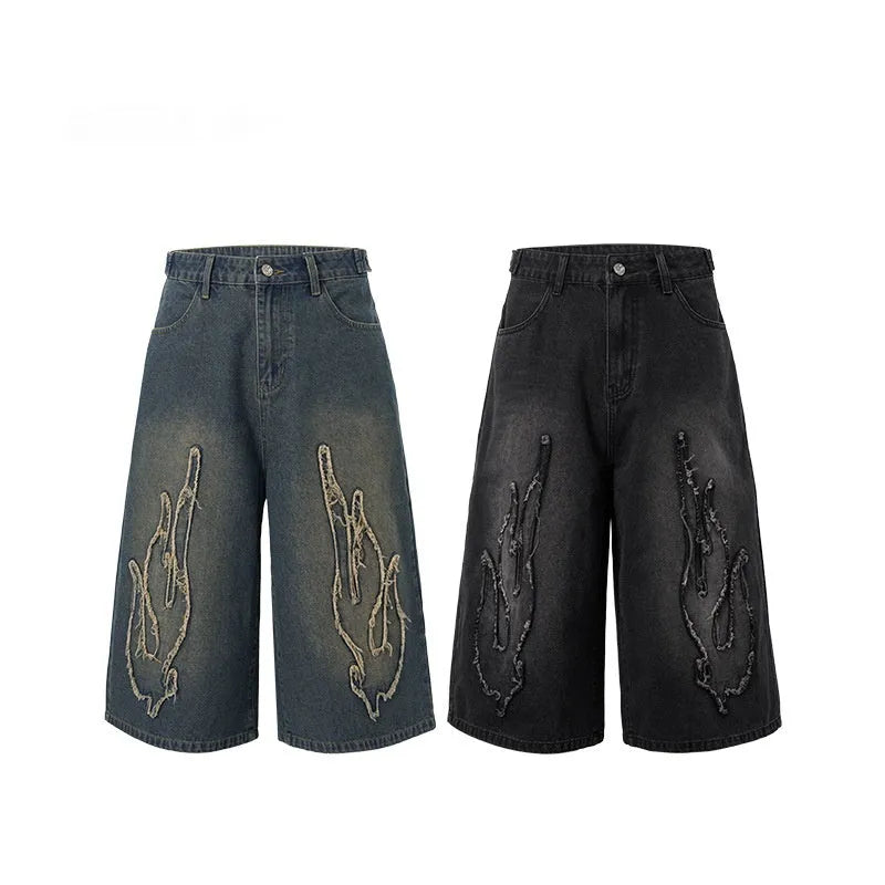 Men's black denim shorts with flame embroidery patch detailing, cropped length, straight leg cut