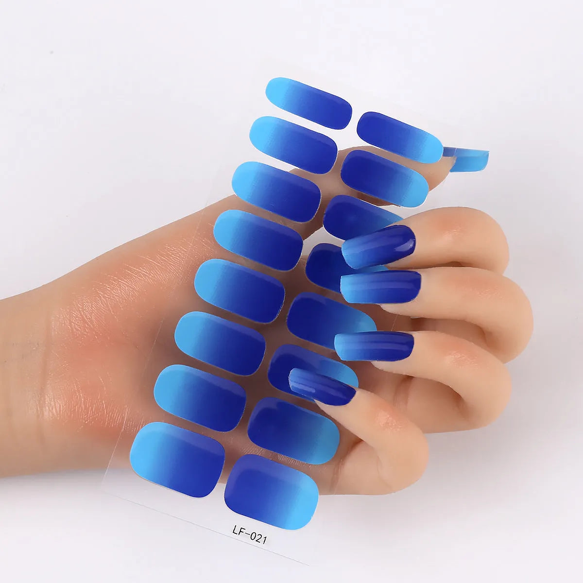 Sheet of 16 solid colour nail art sticker designs including cross, rose, and leopard print patterns.