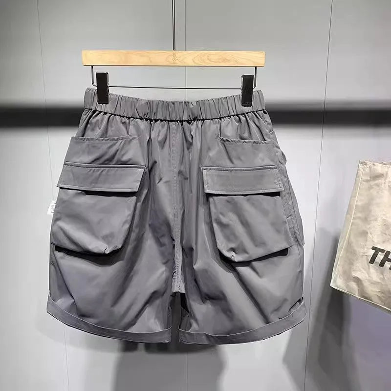 Men's black loose fitting workwear shorts with pockets, above-the-knee length with straight leg design