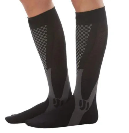 Athletic fit graduated compression socks for men and women in black, shown on a leg.