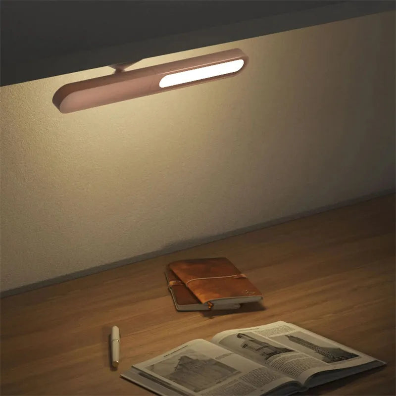 Geometric table lamp with magnetic suction base showing white and khaki colour options