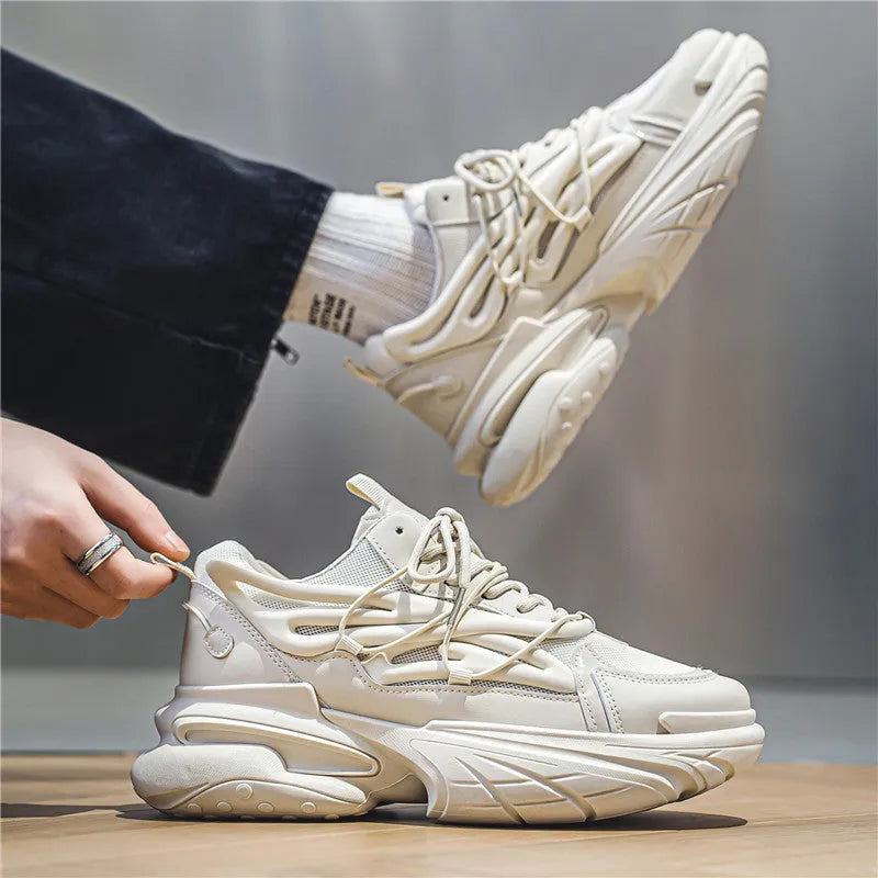 Men's low-top sneaker in beige with breathable mesh upper and rubber sole, lace-up design.