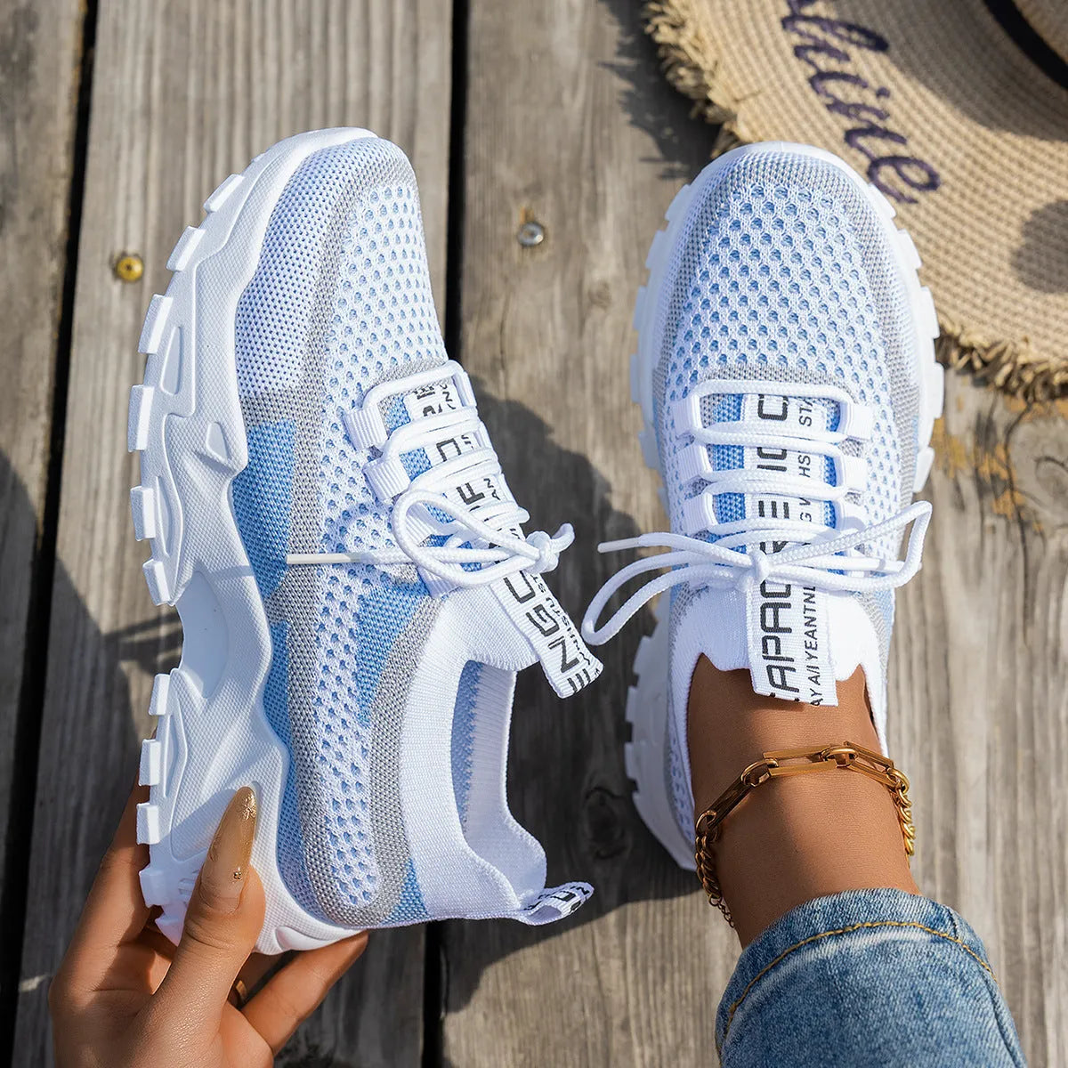 Women's Flyknit mesh lace-up sneakers in multiple colours on a rubber sole.