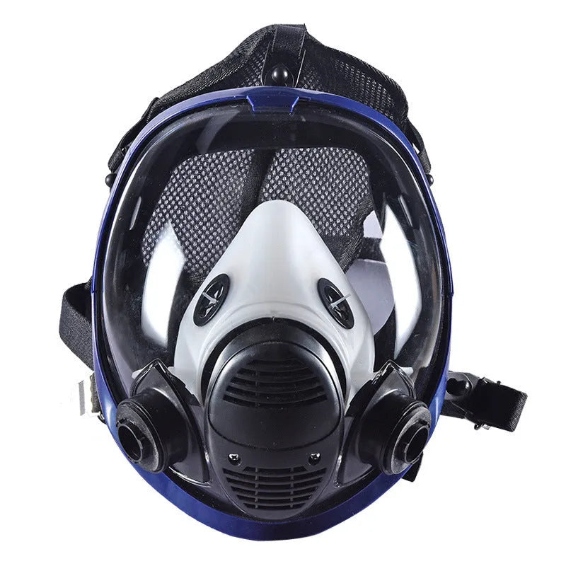 Blue-edged spherical full-face gas mask with a trapezoidal filter canister on a white background.