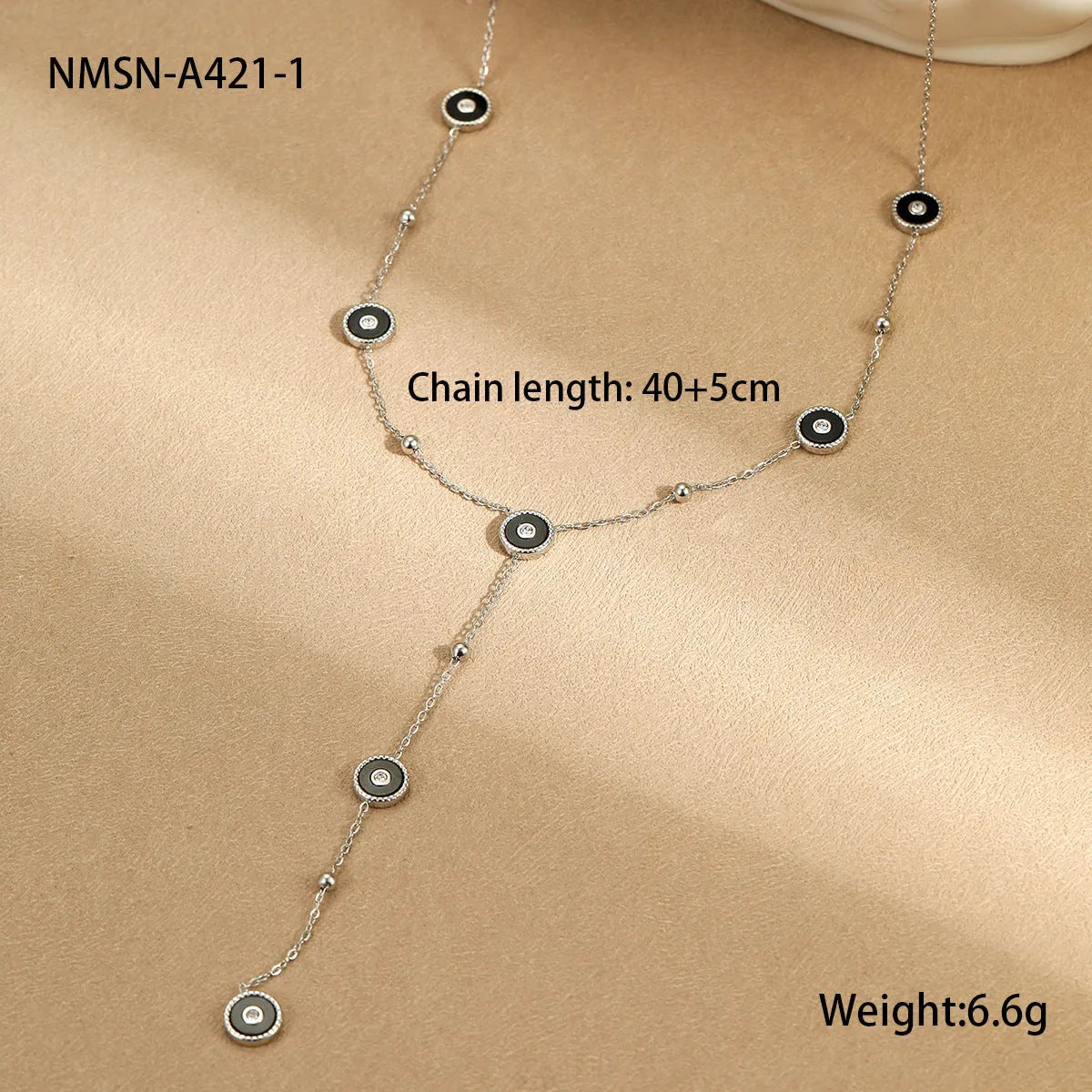 Geometric fritillary design stainless steel bracelet with 18K gold plating and matching necklace