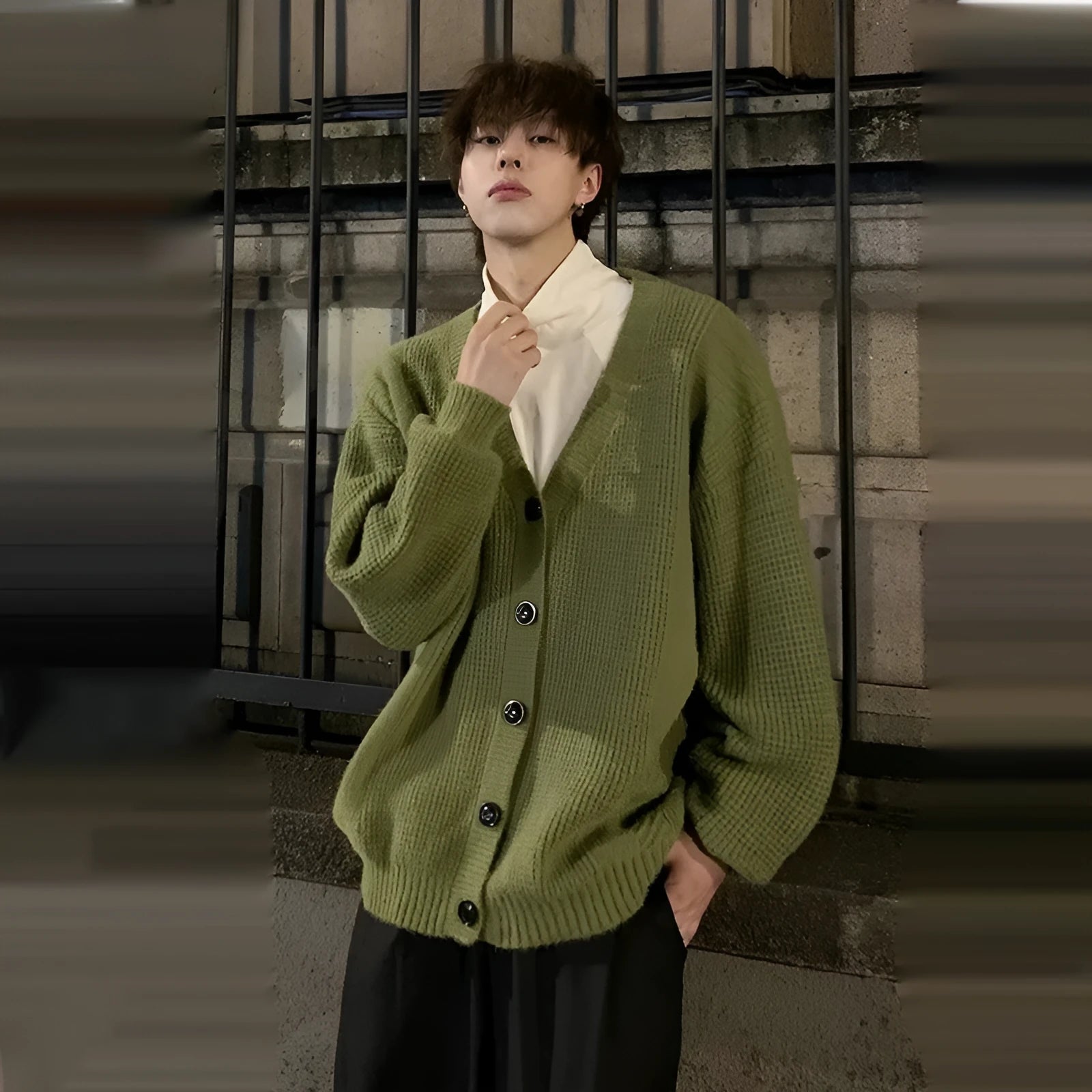 Men's loose V-neck cotton blend cardigan in army green, shown on a hanger.