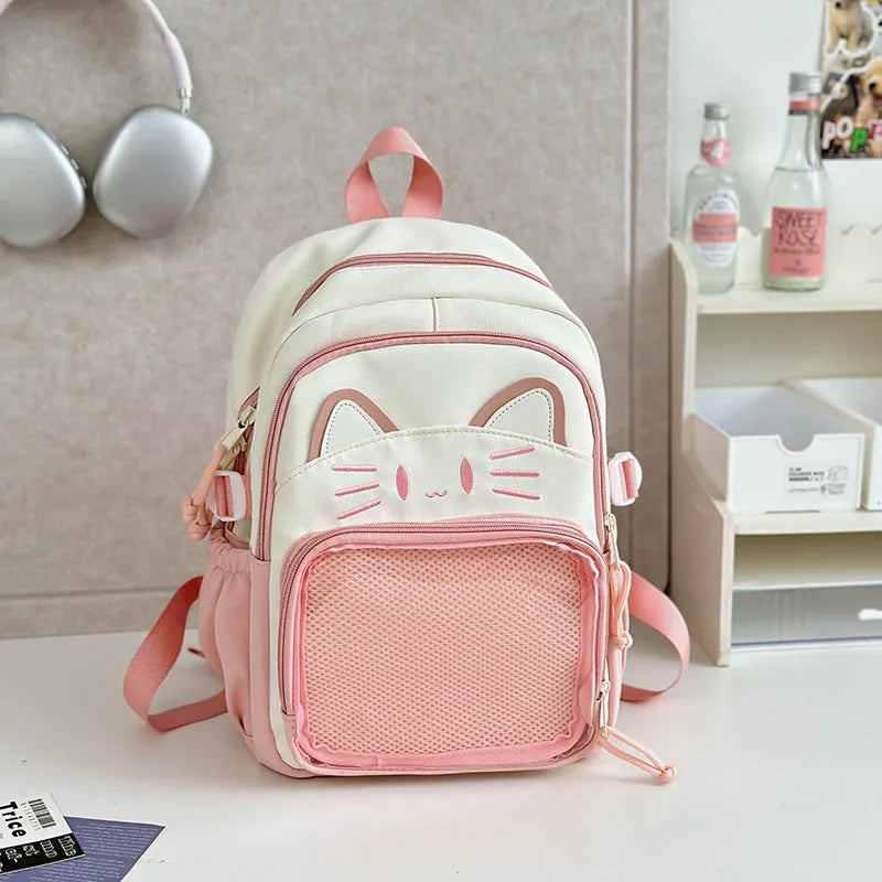 Korean cartoon large capacity nylon backpack in pink colour with badge pendant.