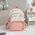 Korean cartoon large capacity nylon backpack in pink colour with badge pendant.