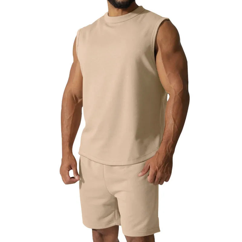 Men's sleeveless cotton blend sports top and shorts set in a solid colour.
