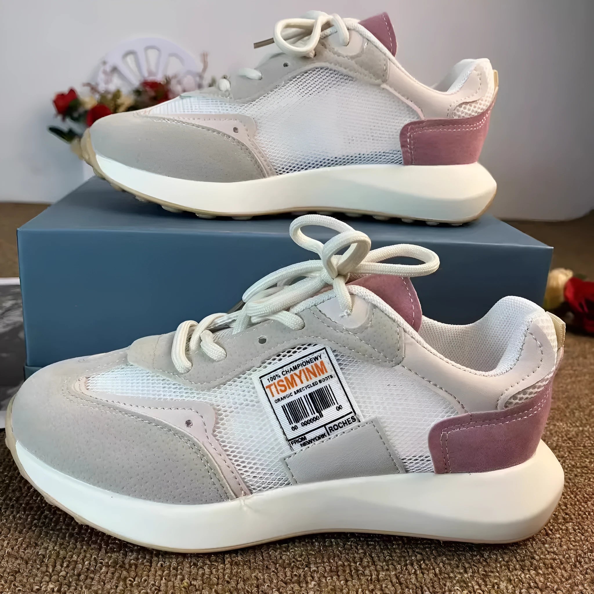 Women's grey retro sneaker with round toe and rubber sole showing mesh lining interior